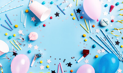 Birthday party backgroung with balloons, confetti, candles, candies and other party supplies top view flat lay with copy space