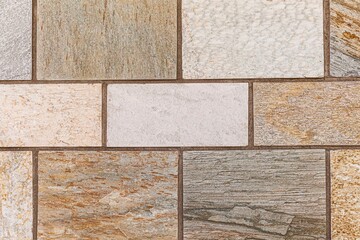 Granite brown stone block walls pattern and seamless background