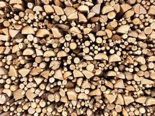 Background of firewood on a sunny day.