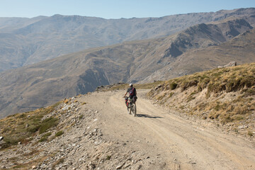 A lone bikepacker in the Sierra Nevada mountains. 