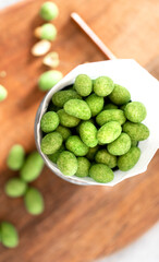 Hot Wasabi Peanuts. Wasabi coated peanuts close-up. Green spicy Japanese snack.