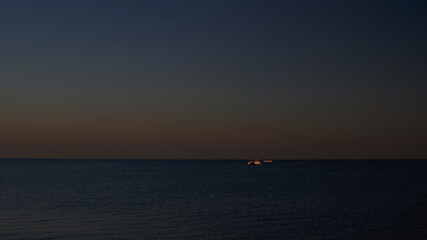 ship on the horizon in the Black Sea at sunset