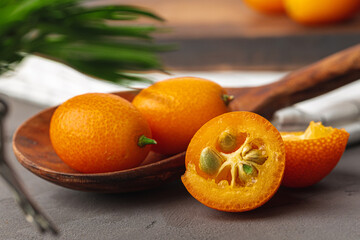 Heap of kumquat fruit on kitchen table