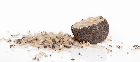 Close up expensive rare black Bulgarian truffle mushroom (Tuber, Ascomycete, fungus). Shredded...