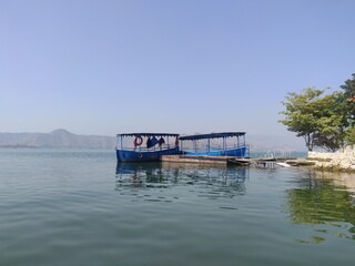 Lonely Boats in a Huge Lake