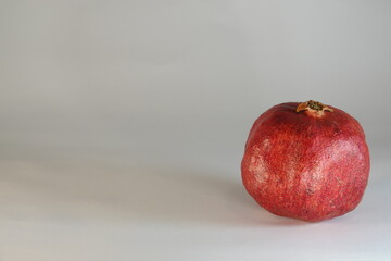 pomegranate fruit on a gray background
