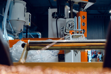 Inside a modern plant producing power electric cables and optical fibers. .Cable manufacturing machine part.