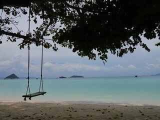 Swing  in white sand beach in Phi Phi island