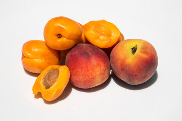 variety of fruits: apricot and peach on a white background, Sunny photo