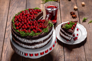 Beautiful delicious cake with bright red berries on the Christmas table