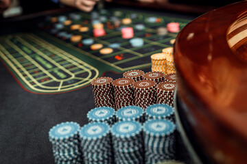 stacks of chips. gambling, casino roulette, bet on black in las vegas. white ball.