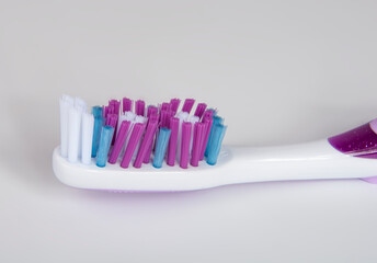 White and violet toothbrush for healthcare teeth on the white