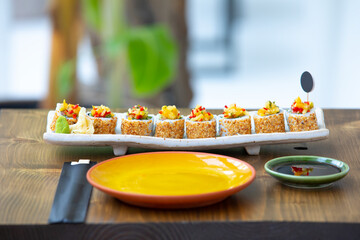 Sushi plate on the table.