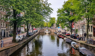 Fototapeta na wymiar Boat in an Amsterdam Canal