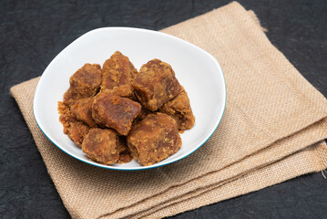 palm jaggery Indian organic Gur with Sugar Cane natural sweeteners cane syrup. Brown palm sugar. Nolen Gur, or Date palm jaggery