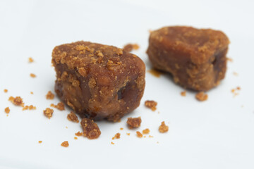 palm jaggery Indian organic Gur with Sugar Cane natural sweeteners cane syrup. Brown palm sugar. Nolen Gur, or Date palm jaggery