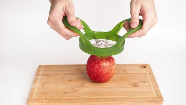 A device for quick slicing apples. Quick apple slicing. Sliced apples. Front view. Isolated. 