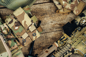 Close up photo of M16 rifle on wooden board