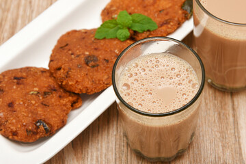 Indian milk tea or Chai and Parippu vada , Dal vada Kerala tea time snacks, popular deep fried hot and spicy food. Traditional food for Ramadan, Eid, Iftar pary, Onam, Vishu. Local street food India.