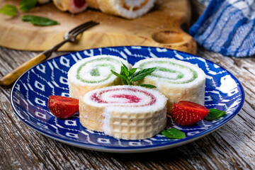 Slices of homemade sweet roll with fruit jam.