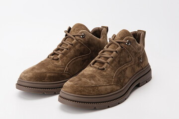 A pair of brown and grey work shoes on a white background