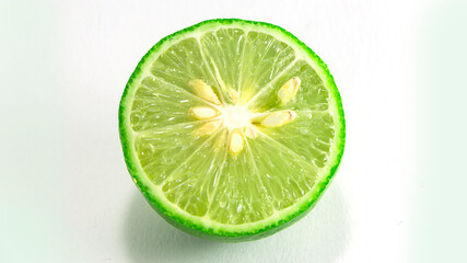 Thai lemons are placed in front of the fruit cluster and separated from a white background.