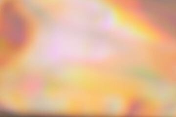 Abstract blurred holographic iridescent foil background. Trendy gradient with vivid colors