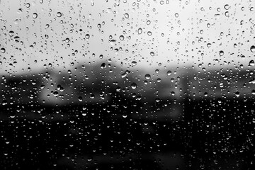 gray wet background / raindrops to overlay on the window, weather, background drops of water rain on the glass transparent