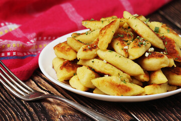 Polish dish kopytka served at the table	
