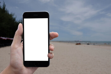 Close-up Of A Woman's Hand Holding Cell Phone With White Blank Screen