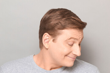 Obraz premium Portrait of funny happy man dreaming about something pleasant