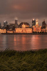 Night view of Shanghai's bund, the historic and modern building skyline along the Huangpu River, China.