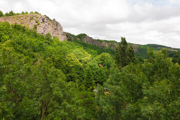 Fototapeta na wymiar Beautiful panorama landscape in Norman Switzerland (Calvados, Normandy, Europe, France). Luxurious preserved forest and cliffs. High view