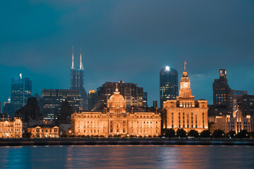 Night view of Shanghai's bund, the historic and modern building skyline along the Huangpu River, China.