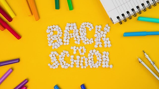 Stop Motion Animation of paper on a yellow background_Back to School
