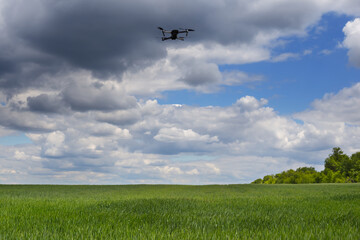 drone flying above a green rural fields
