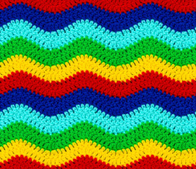 Seamless knitted texture. The zigzag pattern is crocheted with multi-colored threads. Acrylic baby...