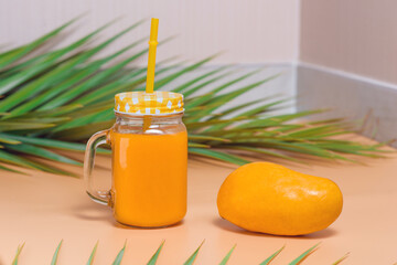 Fresh mango juice and fresh mango fruit on the side. 