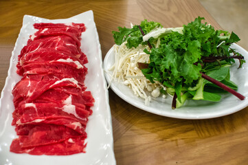 sliced meat and vegetables for shabu
