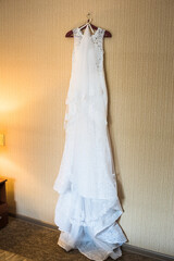 wedding dress on a hanger, wedding day, wedding dress with train, White dress, morning bride