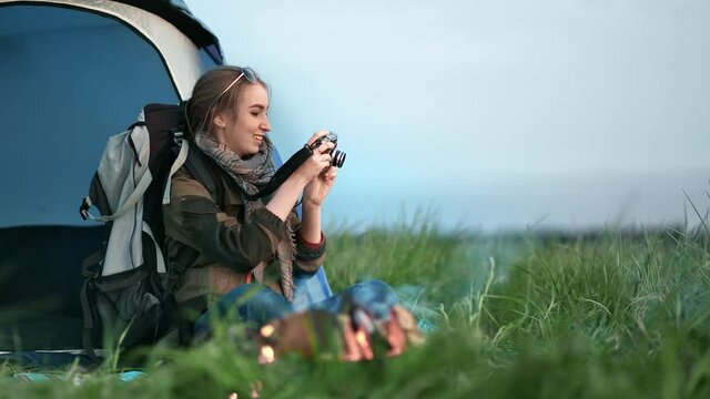 Joyful photograph girl taking picture of amazing natural scenery. Shot on RED Raven 4k Cinema Camera