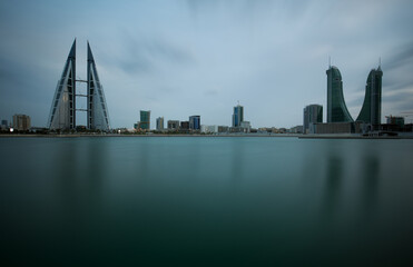 MANAMA, BAHRAIN -  OCTOBER 28: Bahrain skyline with iconic buildings, the Bahrain World Trade .Center and the Financial Harbour during dusk on October 28, 2018, Manama, Bahrain