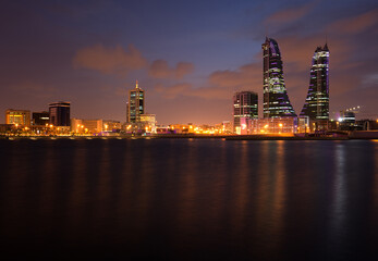 Fototapeta na wymiar MANAMA , BAHRAIN - OCTOBER 28: Bahrain Financial Harbour during dusk on October 28, 2018. It is one of tallest twin towers in Manama, Bahrain.