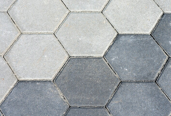 Pavement with two diffent gray hexagon pattern. Cement sidewalk with texture. Background, texture.