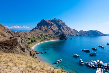 Landscape view from Padar Island, Komodo National Park, Indonesia. A lot of tourist boats at the coast of Padar Island..