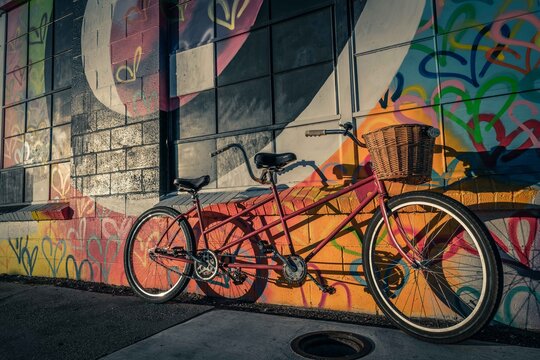 Tandem Bike Leans of a Graffiti Wall