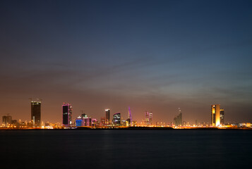 Beatiful illuminated Bahrain skyline with dramatic cloud in the evening