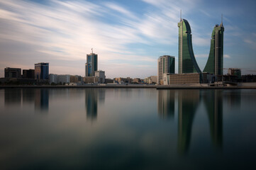 Fototapeta na wymiar MANAMA , BAHRAIN - NOVEMBER 02: Bahrain Financial Harbour with dramatic clouds during morning hours on November 02, 2018. It is one of tallest twin towers in Manama, Bahrain.