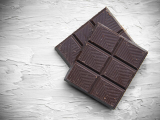 dark chocolate bar on a light background