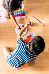 Kids playing and painting with color